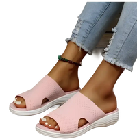 Pink knit slide sandals.