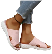 Pink knit slide sandals.