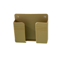 Beige plastic wall mount phone holder from Phoneplugbox Wall Mount Wizard, punch free wall mount