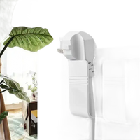 White wall mount phone holder on Phoneplugbox Wall Mount Wizard, punch free wall mount