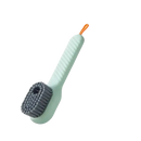 Green cleaning brush with handle.