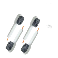 Four white cleaning brushes.