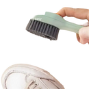 Cleaning brush dispensing liquid.