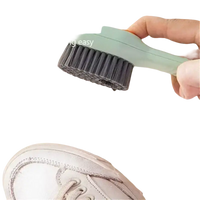 Cleaning brush dispensing liquid.