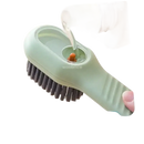 Green liquid-dispensing cleaning brush.
