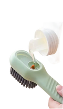 Green cleaning brush with refillable reservoir.