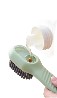 Green cleaning brush with refillable reservoir.