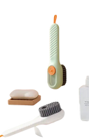 Multifunctional shoe brush with liquid dispensing handle.