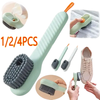Shoe cleaning brush with liquid dispenser.