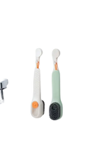 Two hanging cleaning brushes.