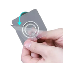 Adhesive wall hook with protective film being peeled.
