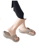 Beige platform flip-flops.
