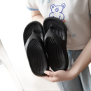 Black rubber flip-flops.