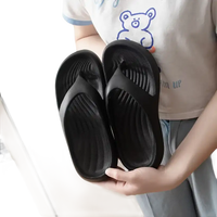 Black rubber flip-flops.