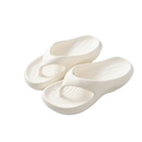 Pair of white, cushioned flip-flops.