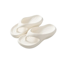 Pair of white, cushioned flip-flops.