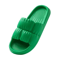 Green puffy slide sandal.