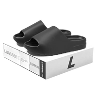 Black unisex slide sandals.