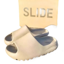 Beige foam slip-on sandals.