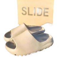 Beige foam slip-on sandals.