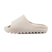 Beige slip-on sandal.