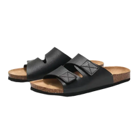 Black leather sandals with cork soles.