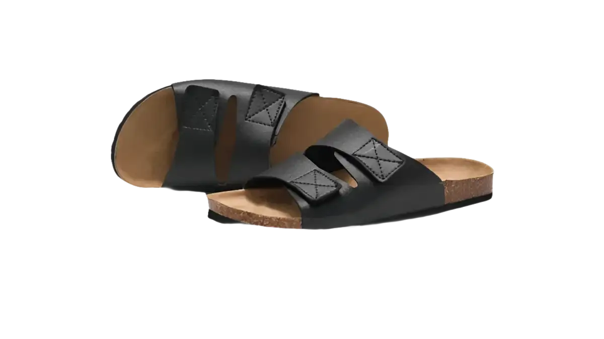 Black leather slide sandals.