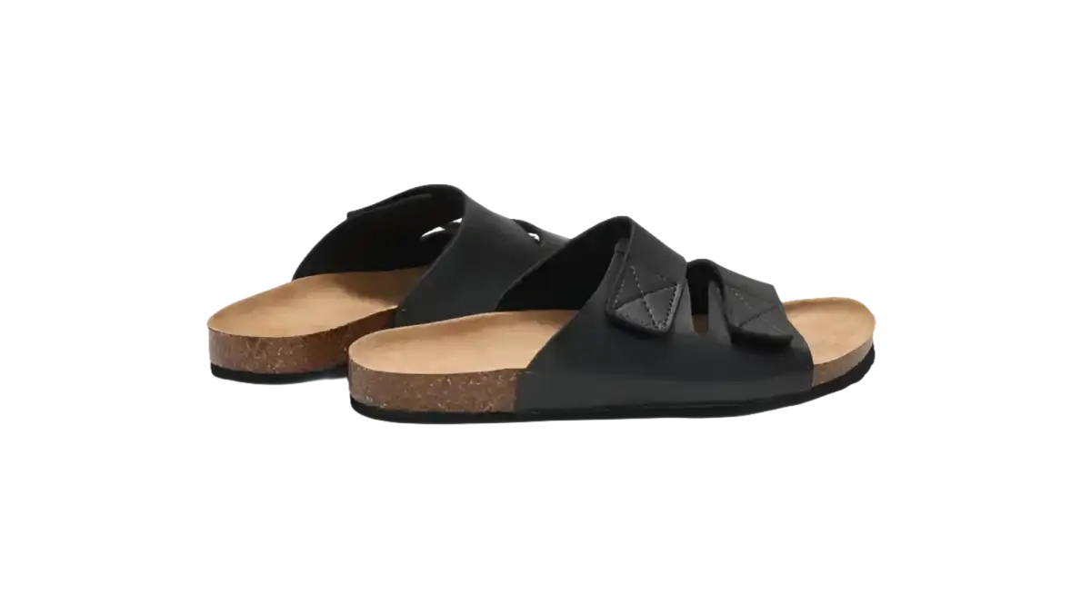 Black leather slide sandals.