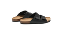 Black leather slide sandals.