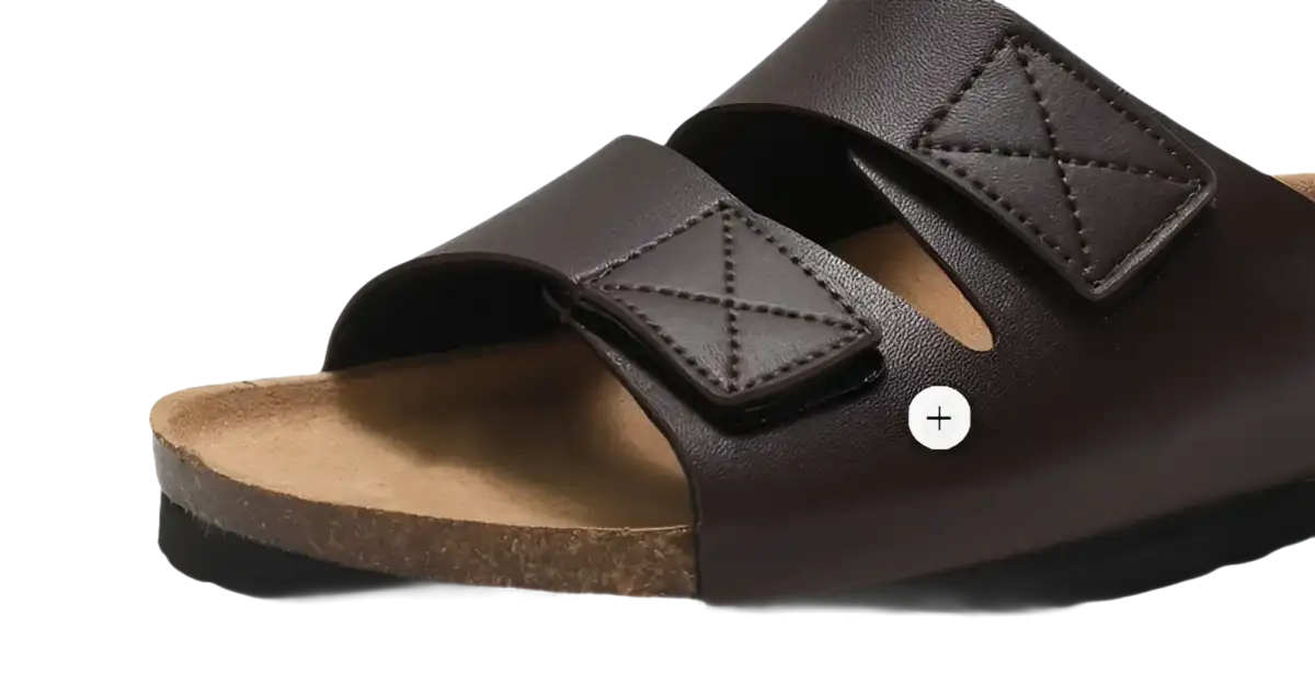 Brown leather sandal with velcro straps.