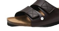 Brown leather sandal with velcro straps.