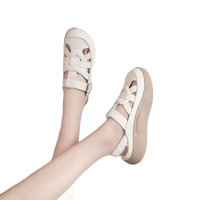 Beige leather platform sandals.