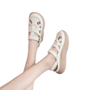 Beige leather platform sandals.