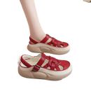 Red leather platform sandals.