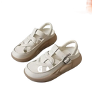 Pair of white platform sandals.