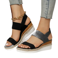 Black elastic wedge sandals.