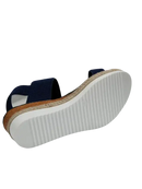 Navy blue elastic sandal with jute platform.