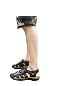 Black leather fisherman sandals.