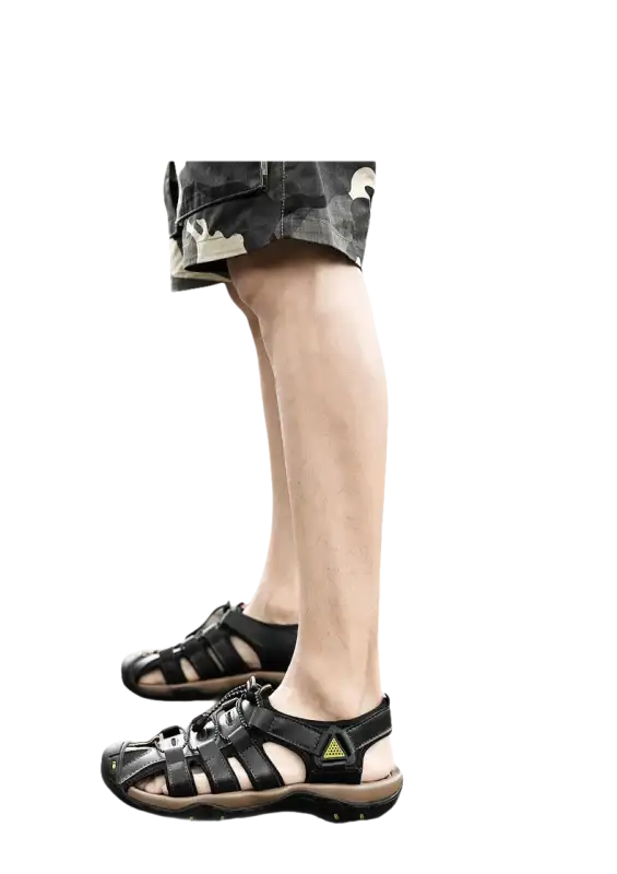 Black leather fisherman sandals.