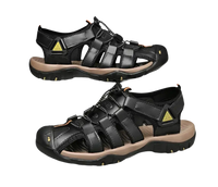 Black leather fisherman sandals.