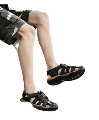 Black leather fisherman sandals.
