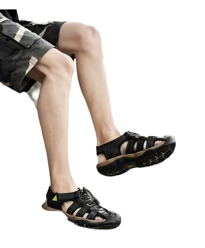 Black leather fisherman sandals.