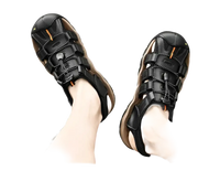 Black leather fisherman sandals.