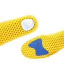 Yellow honeycomb insoles with blue damping pads.
