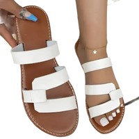 Brown and white leather sandals.