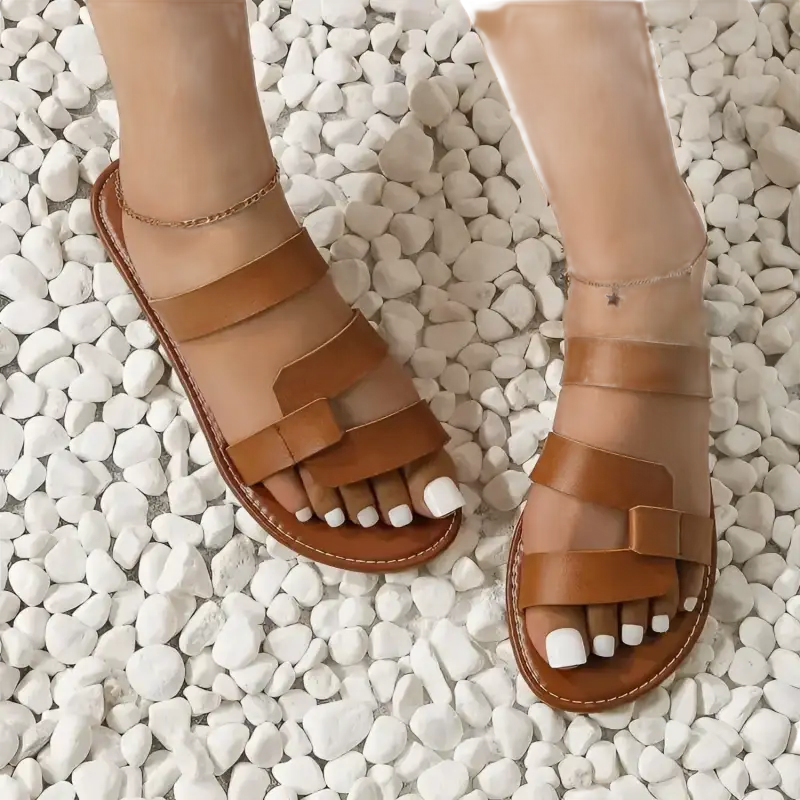 Brown leather slide sandals.