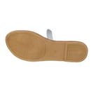 White sandal with brown sole.
