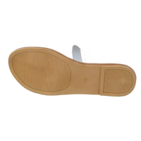 White sandal with brown sole.