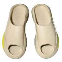 Beige open-toe platform slides.