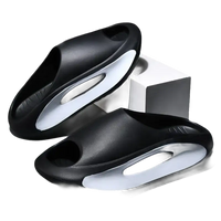 Black and white cushioned slides.